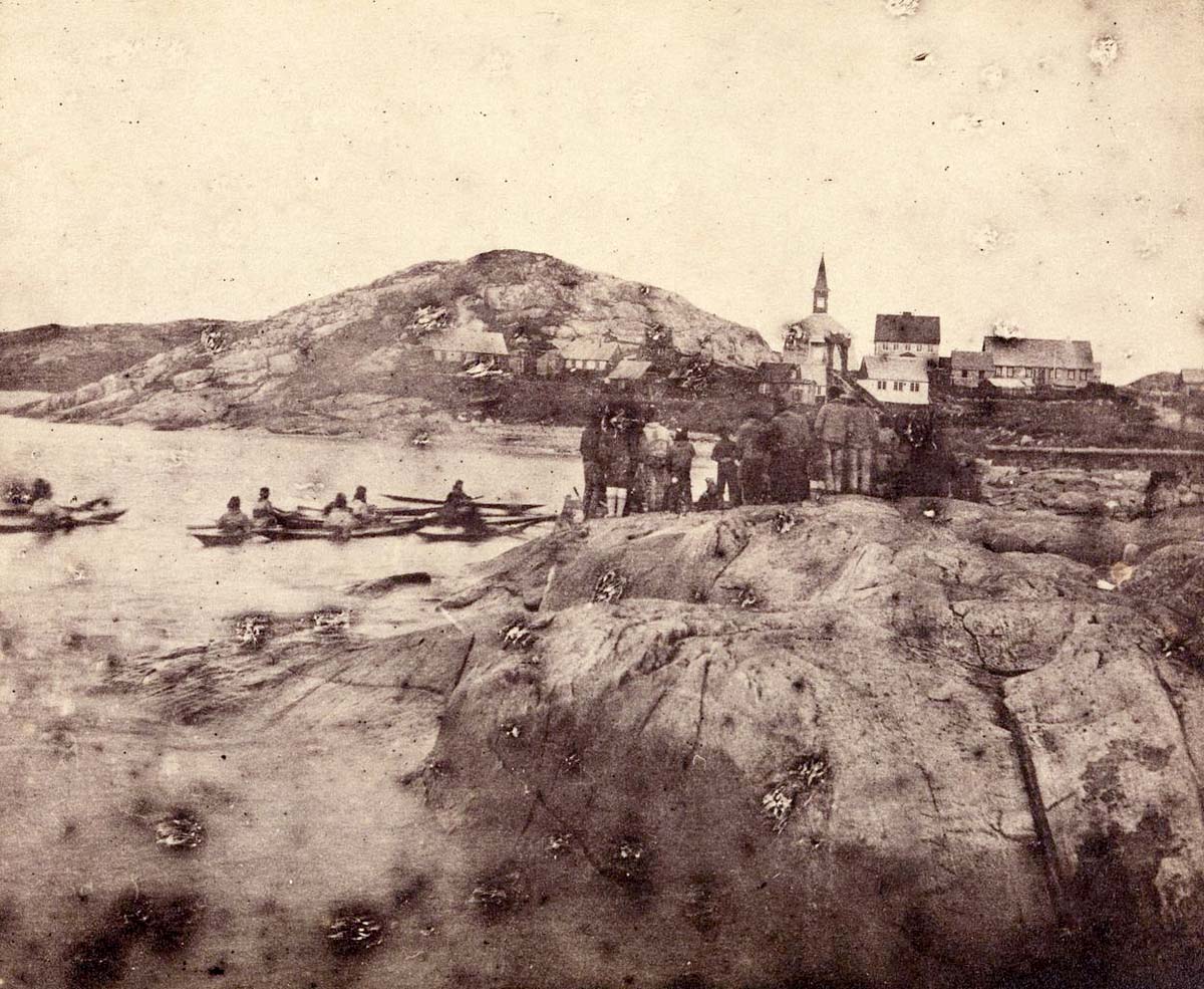 Nuuk (Godthåb, Godthaab). View toward the city including Inuits on land and in kayaks, before 1889