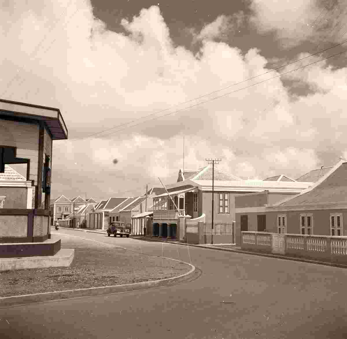 Kralendijk. Panorama of the city street with car, 1947