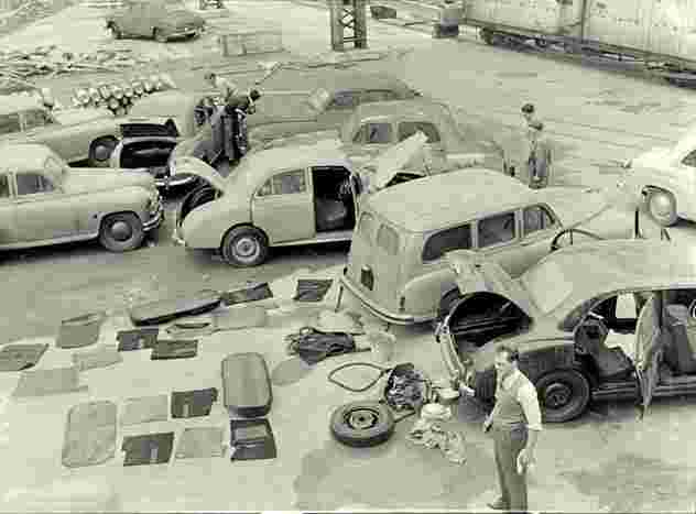 Hororata. Fire damaged cars off the British ship, 1955