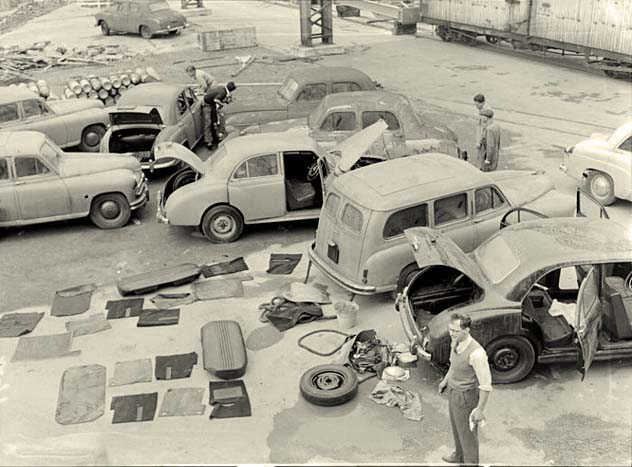 Hororata. Fire damaged cars off the British ship, 1955